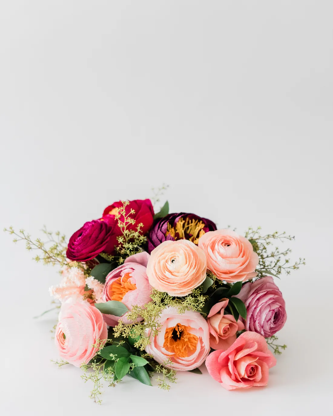 A pink and coral paper bouquet